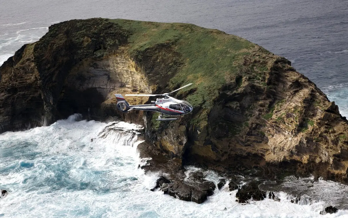 The sea cliffs of Molokai from a doors-off Maui helicopter tour